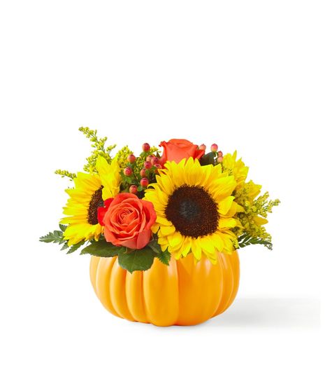 classic sunflowers and orange roses in pumpkin shaped container