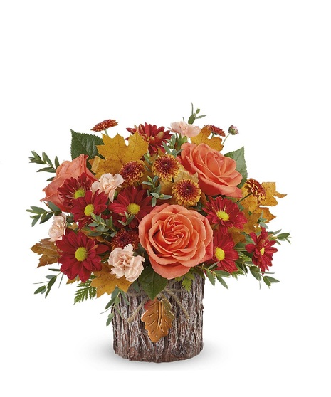 harvest toned flowers in copper vase