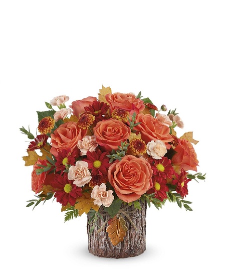 harvest toned flowers in copper vase